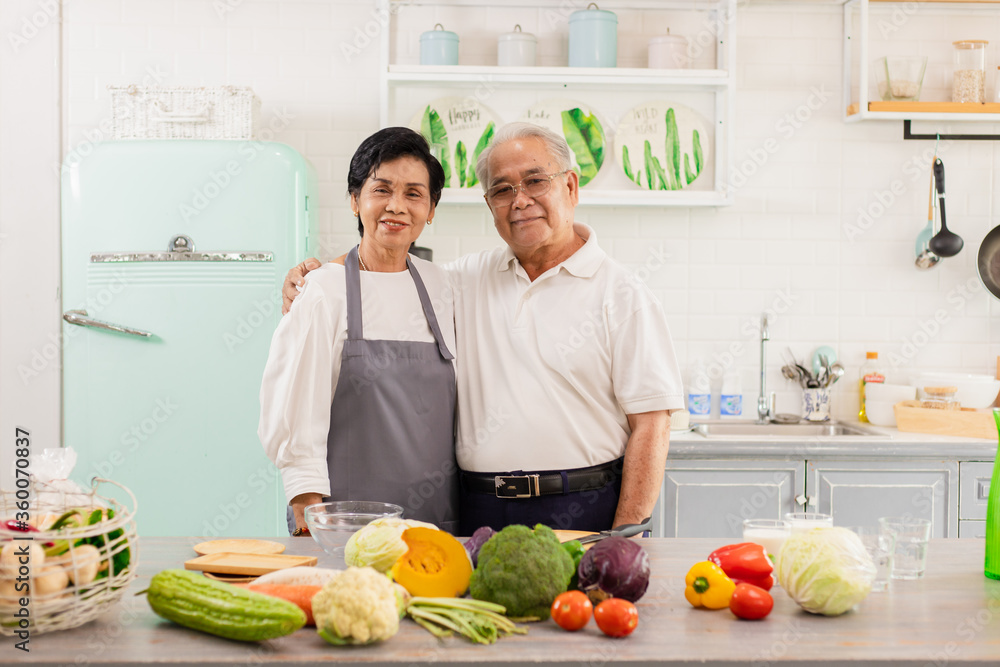 Asian Elderly couple cooking in the home kitchen. Asian Elderly couple cooking in the home kitchen.