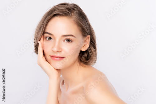 Beautiful Young Woman touching her clean face with fresh Healthy Skin  isolated on white background  Beauty Cosmetics and Facial treatment Concept