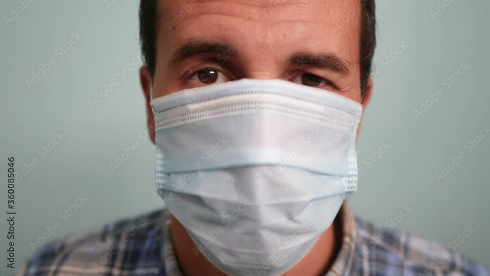 man wear protective mask a indoor portrait. epidemic corona outbreak concept. male 37 years old brunette in medical mask isolated. Coronavirus disease. dad teamwork lifestyle self-isolation in home man wear protective mask a indoor portrait. epidemic corona outbreak concept. male 37 years old brunette in medical mask isolated. Coronavirus disease. dad teamwork lifestyle self-isolation in home