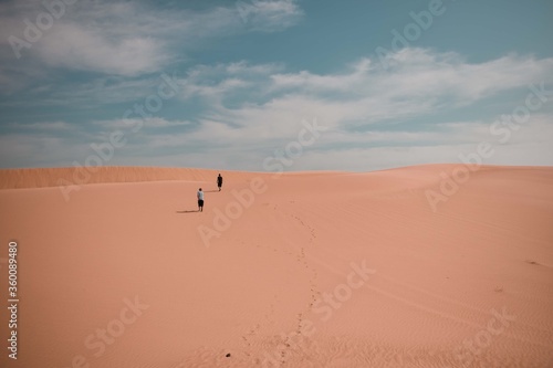 Two people in the Wahiba Desert Oman