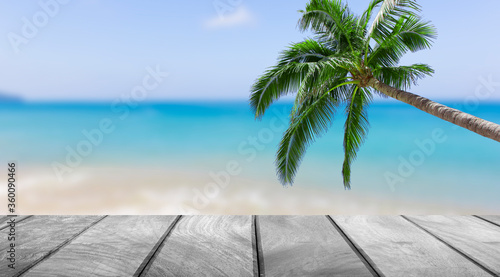 Empty wooden with palm tree and beautiful sea background, Product display summer concept