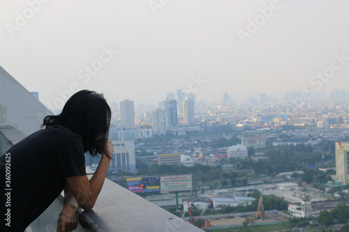 A man wearing dust mask. Level of PM2.5 particulate matter reached higher. Weather conditions created a health risk over a large swath of Bangkok