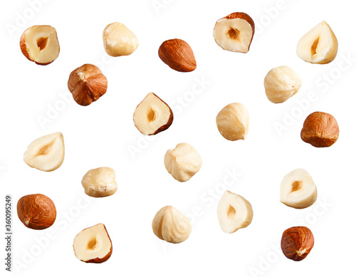 Full and halfs of hazelnuts on white background.