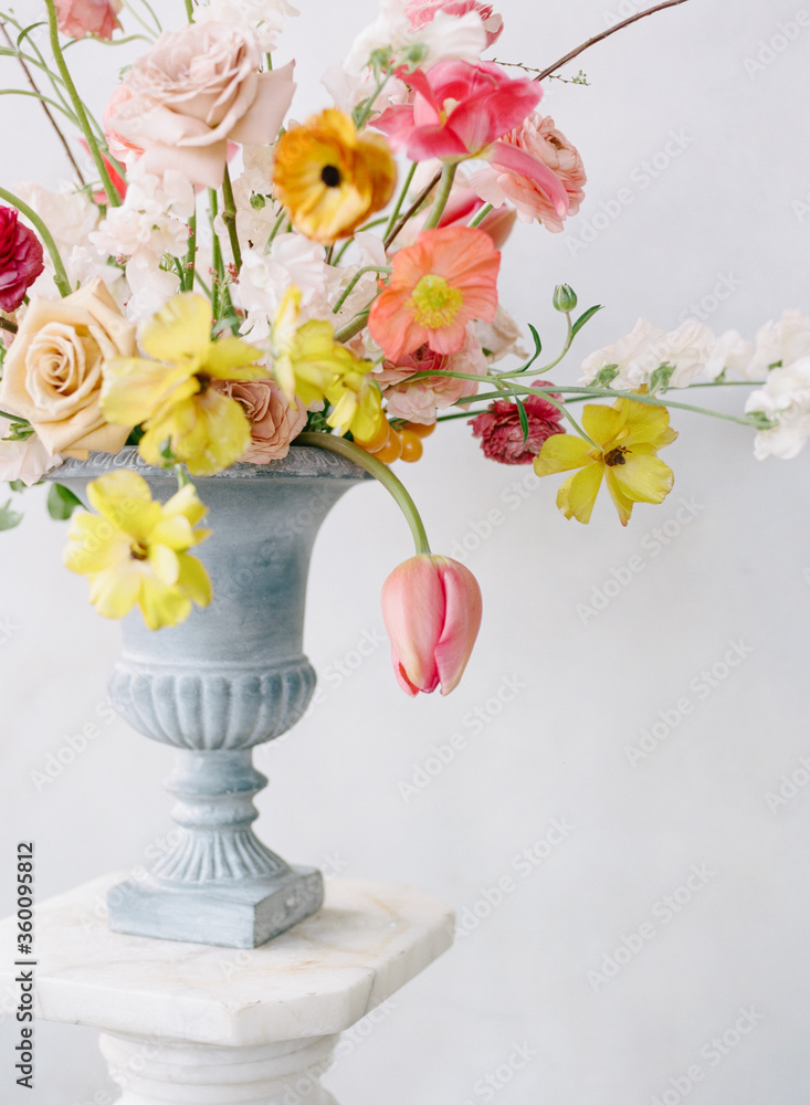 A floral arrangement of spring blooms arranged in a vase
