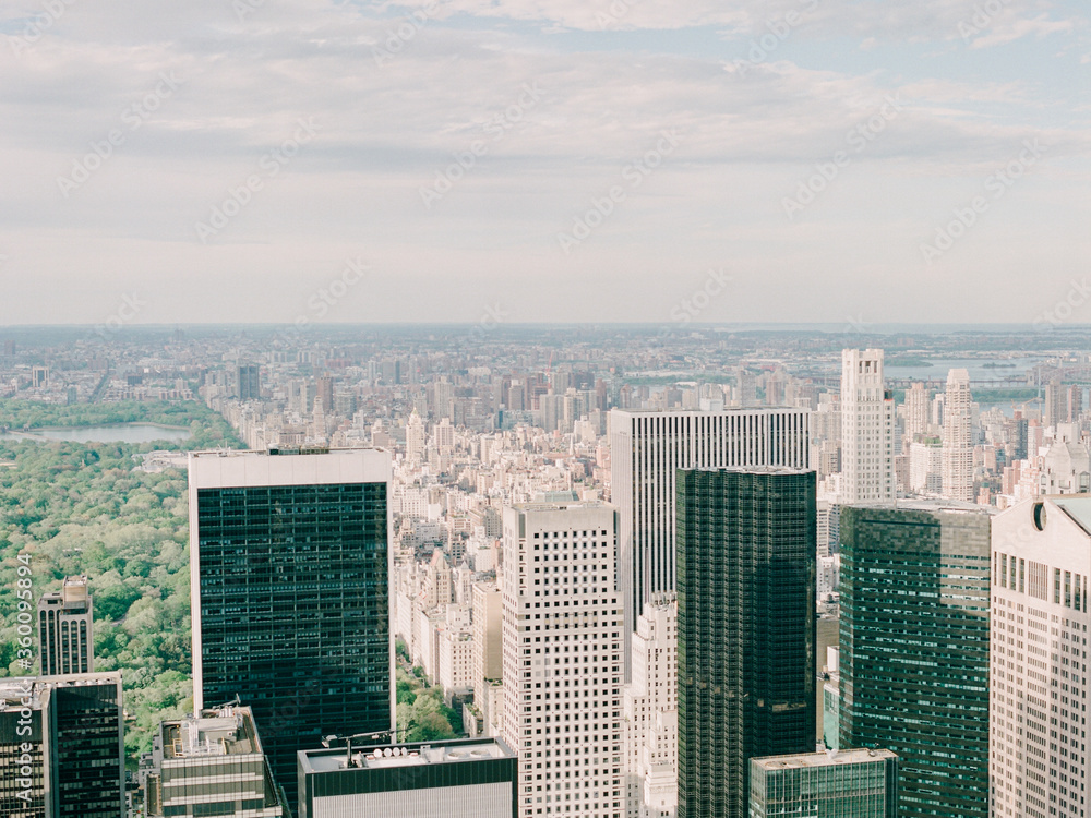 Fototapeta premium A vignette of NYC skyline and Central Park on a sunny summer day photographed on film from Top of the Rock Observation Deck