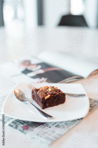 brownies on white plates put on marble tables