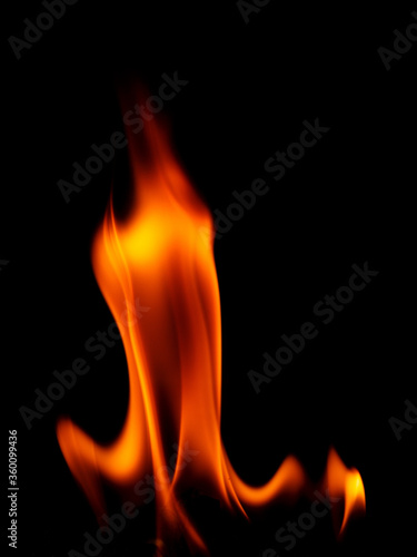 Real fire line flames isolated on black background. Mockup fire wall.