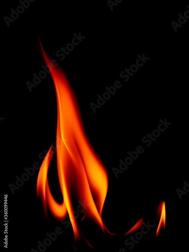 Real fire line flames isolated on black background. Mockup fire wall.