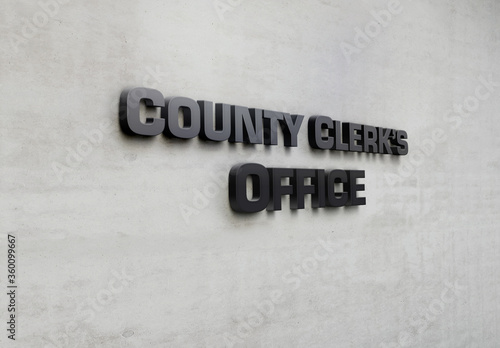 Fényképezés A building metal signage that says 'County Clerk's Office'.