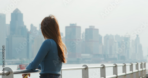Woman looks at the city in Hong Kong