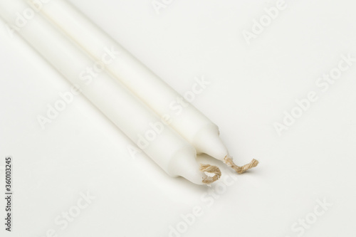 White candles isolated on a white background.