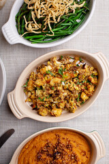 Traditional Thanksgiving sides, green beans casserole, stuffing and sweet potatoes