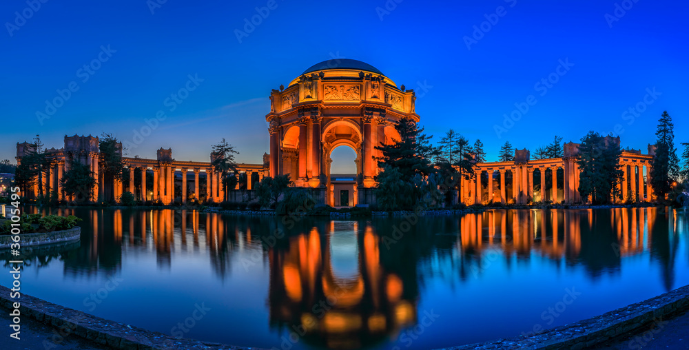 Panorama with the iluminated Palace of Fine Arts during the blue hour at sunset in San Francisco, California photographed in HDR