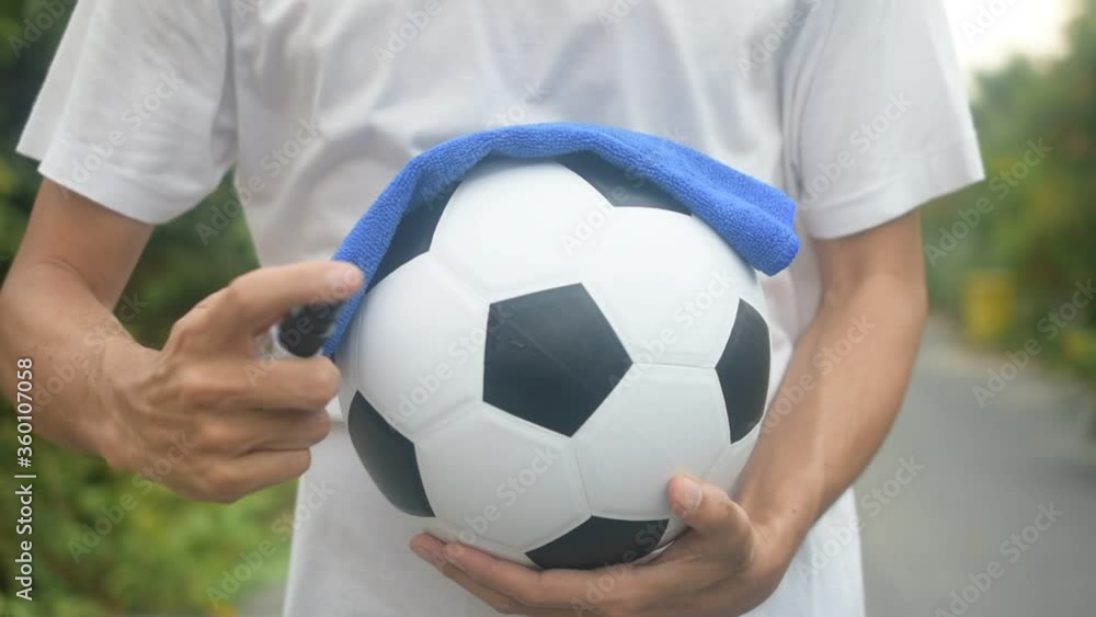 People use alcohol spray cleaning football soccer People use alcohol spray cleaning football soccer