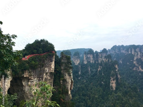 Rocky natural bridge and mountain cliffs at Zhangjiajie national park, Wulingyuan, Hunan, China © GK_musaico