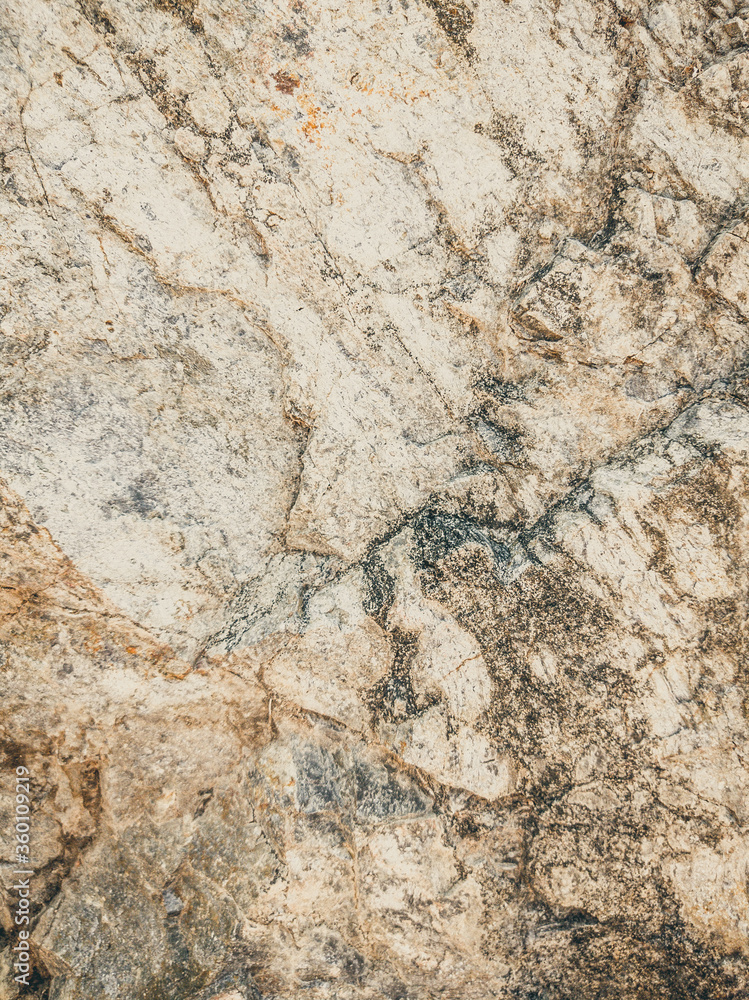 Natural background. Closeup edged shabby cliff cracks. Gray-brown stone rock texture of mountains. Vintage and faded matt style colour in tinted photo. Concept of geolog, mountaineering or hard work Natural background. Closeup edged shabby cliff cracks. Gray-brown stone rock texture of mountains. Vintage and faded matt style colour in tinted photo. Concept of geolog, mountaineering or hard work