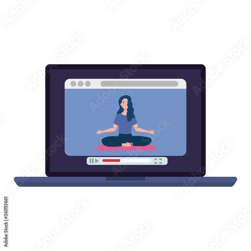 online, yoga concept, woman practices yoga and meditation, watching a broadcast on a laptop computer