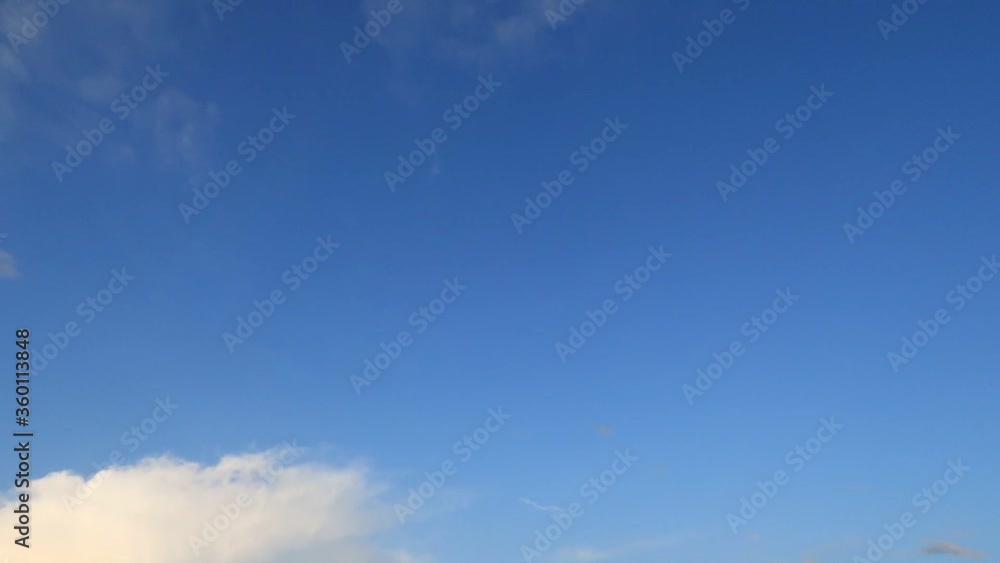 Day to night clouds TimeLapse of beautiful sunny blue sky with wispy fluffy white cirrus or cirrostratus & cumulus cloudscape turn to dark twilight horizon with gray puffy cloud at scary night scene Day to night clouds TimeLapse of beautiful sunny blue sky with wispy fluffy white cirrus or cirrostratus & cumulus cloudscape turn to dark twilight horizon with gray puffy cloud at scary night scene