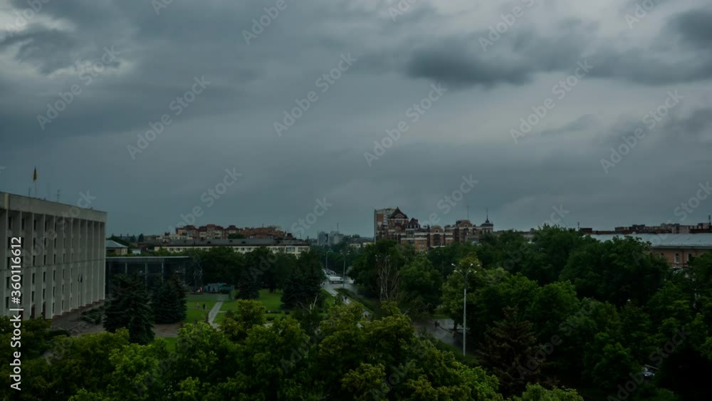 Coming hard thunderstorm over city, black clouds drag the sky before the rain Coming hard thunderstorm over city, black clouds drag the sky before the rain