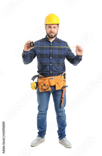 Male worker with tape measure on white background