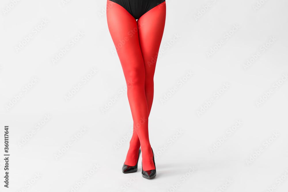 Beautiful young woman in tights on light background Beautiful young woman in tights on light background