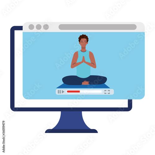 online, yoga concept, man afro practices yoga and meditation, watching a broadcast on a computer