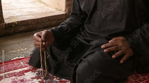Muslim man praying at an old mosque in Phra Nakhon Si Ayutthaya Province, Thailand, Asian Muslims	 photo