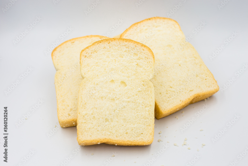 Three slices of bread on a white background.