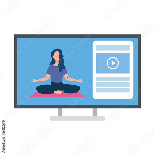 online, yoga concept, woman practices yoga and meditation, watching a broadcast on a computer