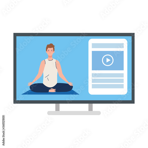online, yoga concept, man practices yoga and meditation, watching a broadcast on a computer