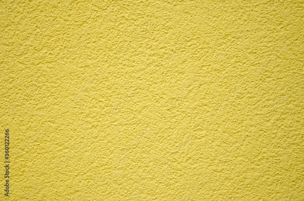 Yellow embossed plaster texture for walls and background Yellow embossed plaster texture for walls and background
