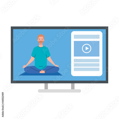online, yoga concept, man practices yoga and meditation, watching a broadcast on a computer