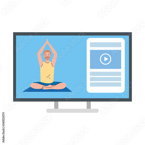 online, yoga concept, man practices yoga and meditation, watching a broadcast on a computer