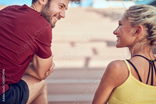 Modern couple doing exercise in urban area.