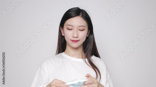 Take off Asian Beauty Wearing Medical Mask photo