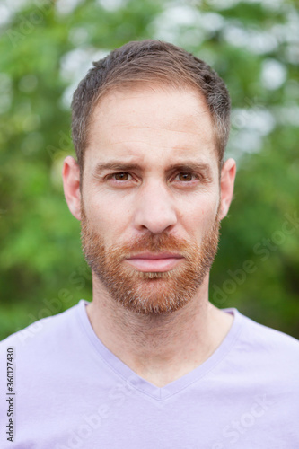 Portrait of a casual bearded man in a park © Gelpi