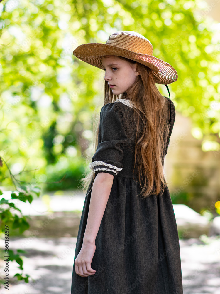 Young girl with long hair in a straw hat, a girl in a headdress, a ...