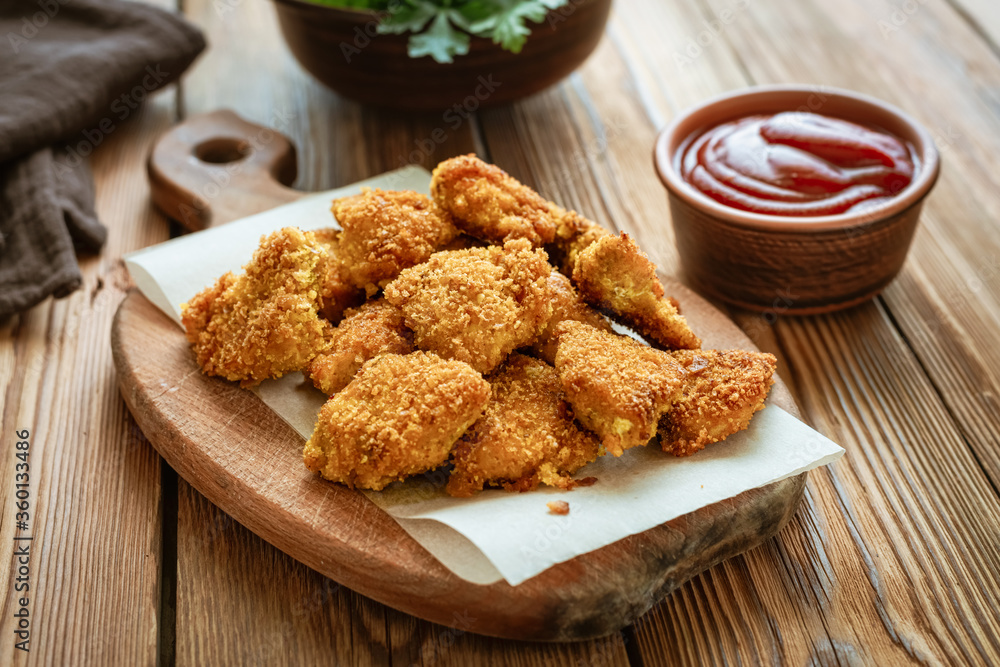 Homemade Chicken Nuggets on a Cutting Board Homemade Chicken Nuggets on a Cutting Board