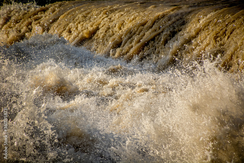 Bilde på lerret Close up raging flooded river