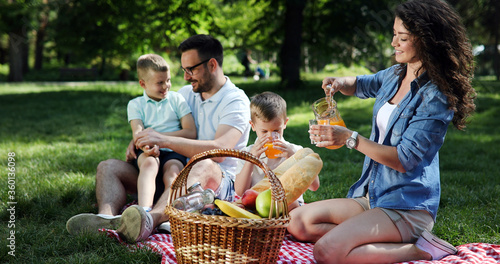 Cheerful happy family picnicking on a beautiful day