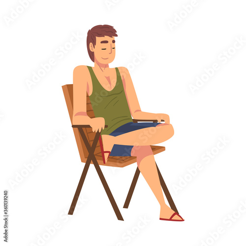 Relaxed Young Man Sitting in Beach Chair, Lounging Male Character Enjoying His Leisure Vacation, Summer Holidays and Traveling Cartoon Vector Illustration