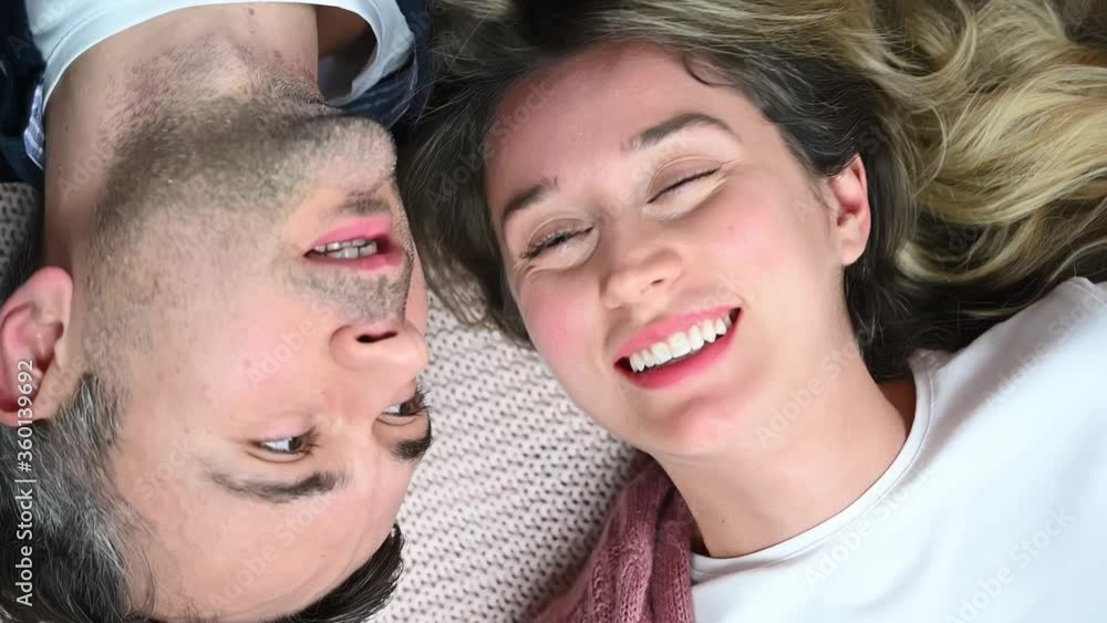 Happy couple smiling face to face, top view Happy couple smiling face to face, top view