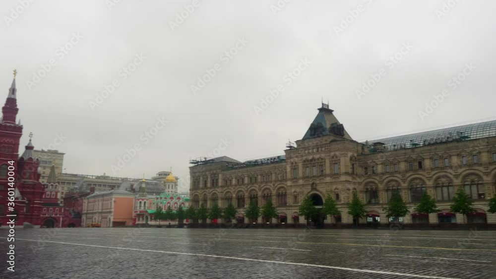 Wet Red square pavement without tourists in rainy afternoon. Empty touristic place during pandemic Wet Red square pavement without tourists in rainy afternoon. Empty touristic place during pandemic