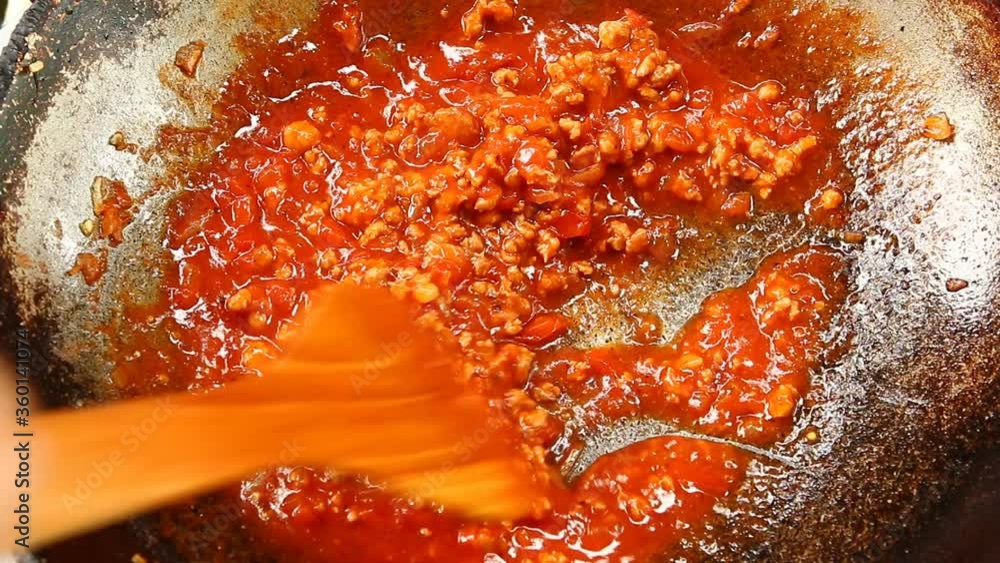 Cooking tomatoes sauce in pan, in door Chiangmai Thailand Cooking tomatoes sauce in pan, in door Chiangmai Thailand