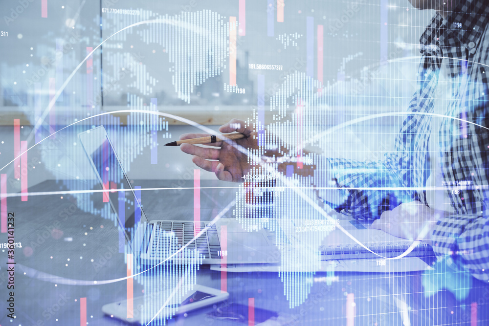 Obraz premium Multi exposure of businessman working on laptop on background. International business hologram in front. Concept of success.