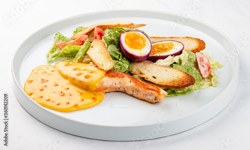 Turkey fillet with vegetables, egg and red caviar sauce