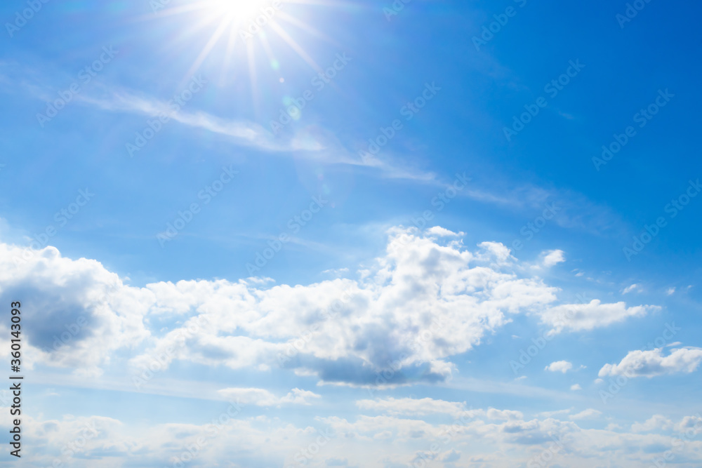 beautiful blue sky background with cumulus clouds and a bright sunny day at summer
