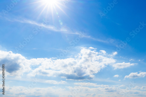 beautiful blue sky background with cumulus clouds and a bright sunny day at summer
