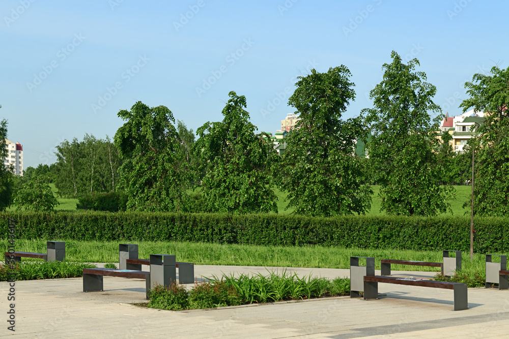 Empty benches in landscape park. Moscow, Russia