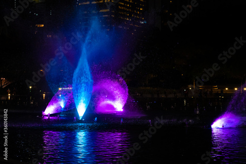 Night view of the dancing multi-colored fountains. Show of Singing Fountains © Kate